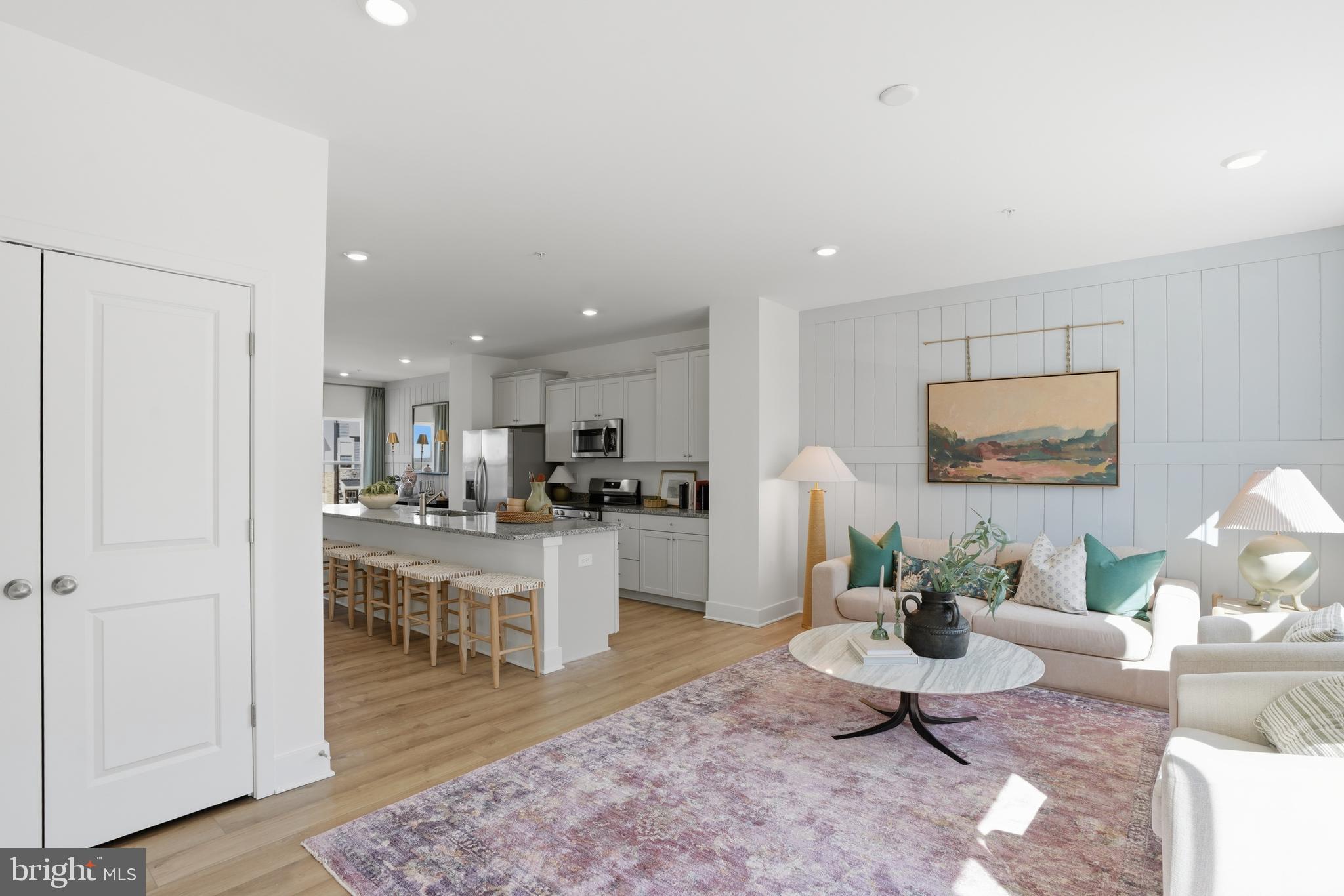 7610 River Reach Road Baltimore, MD 21244 - Photo 9 of 16 a living room with furniture wooden floor and a rug
