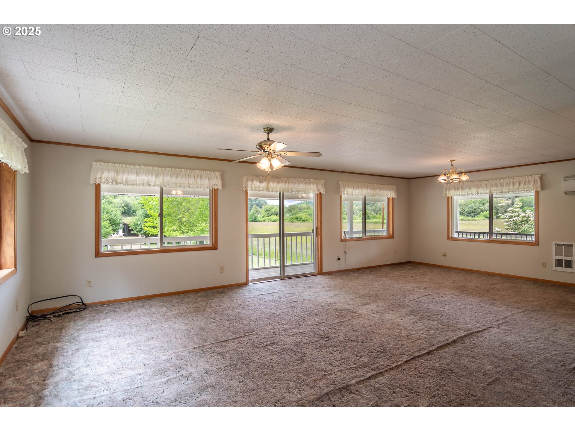 3333 Bullock Road Oakland, OR 97462 - Photo 11 of 48 a view of n empty room with windows