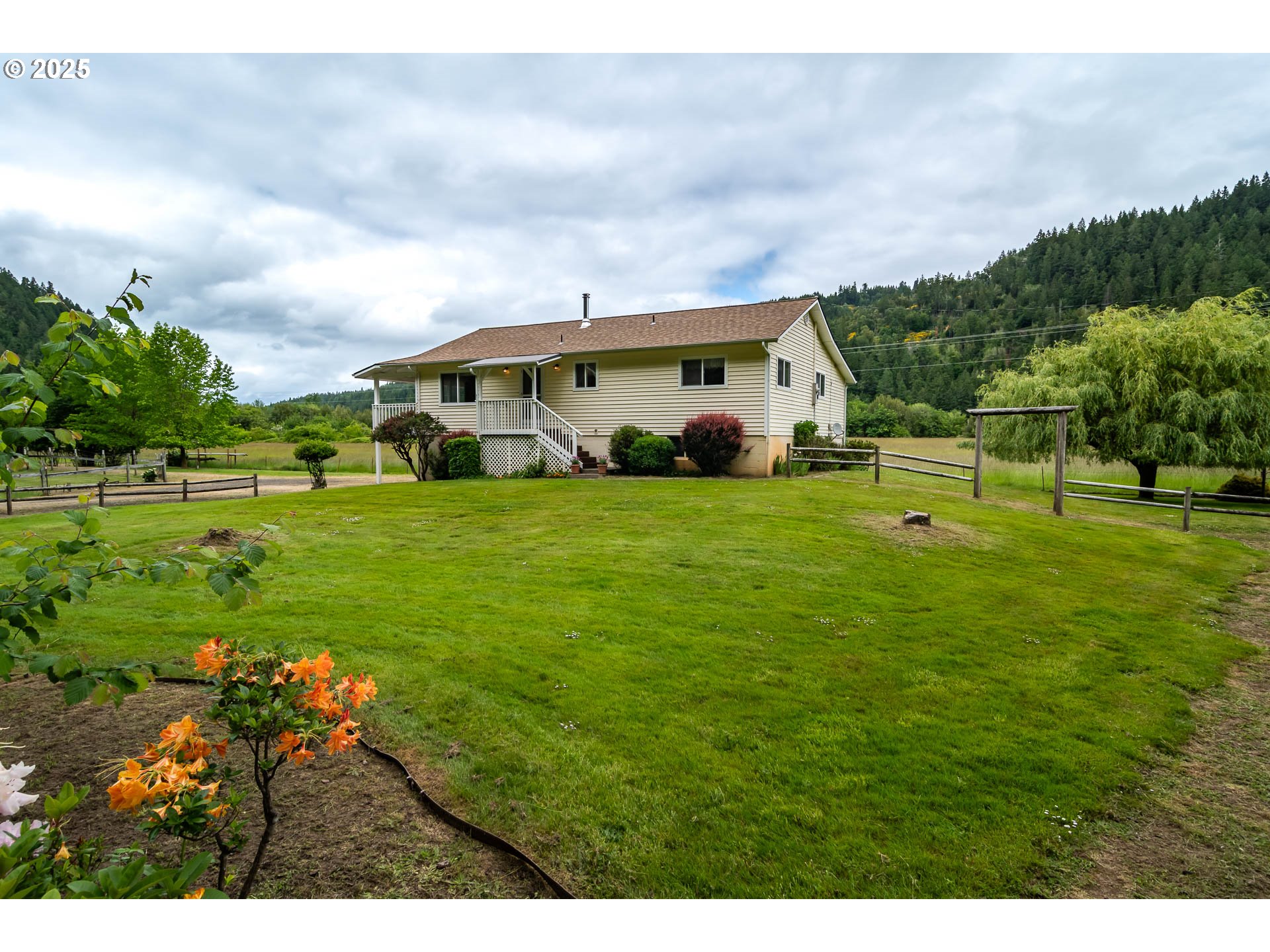 3333 Bullock Road Oakland, OR 97462 - Photo 47 of 48 a view of a house with a big yard and large trees
