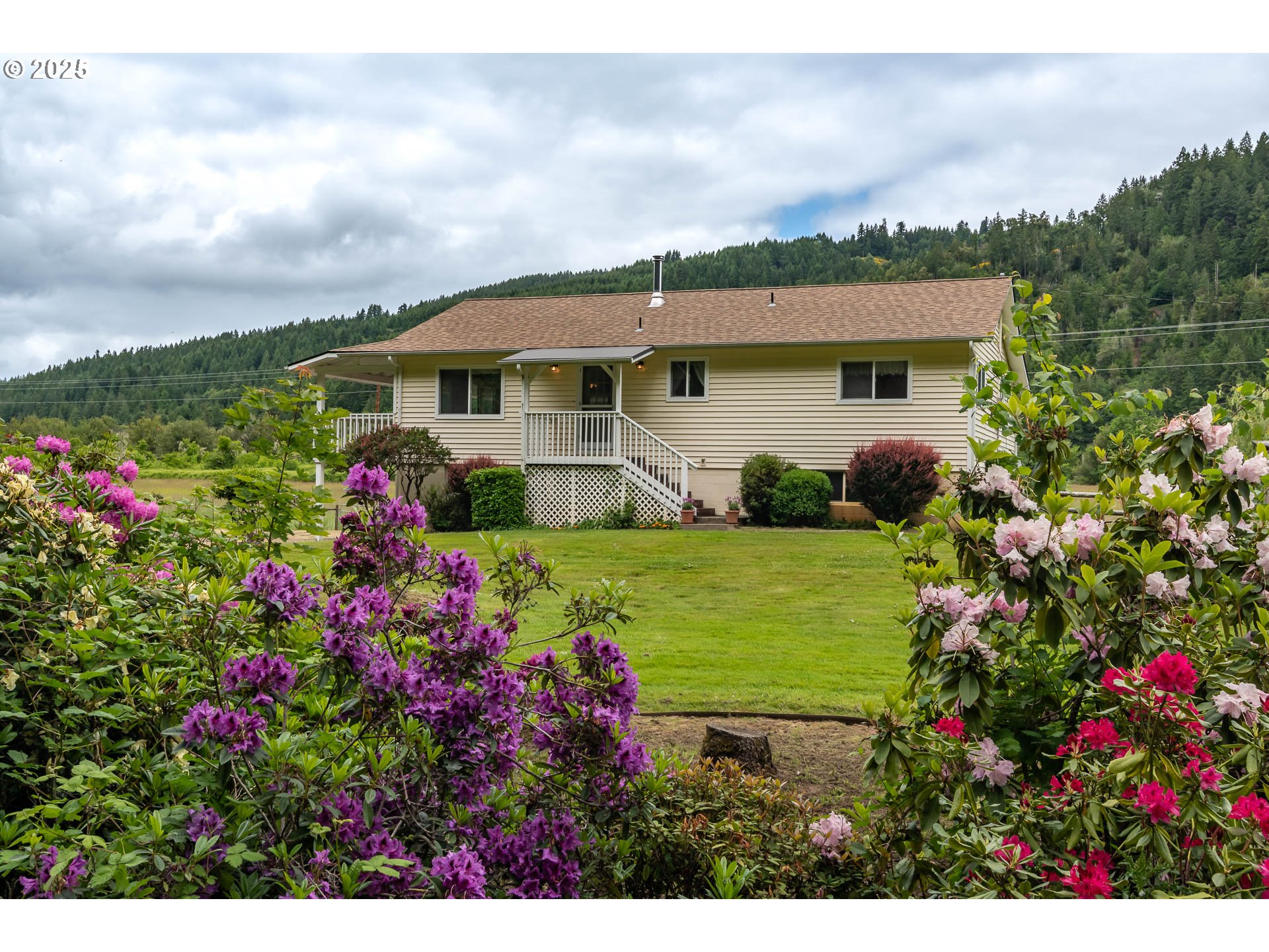 3333 Bullock Road Oakland, OR 97462 - Photo 5 of 48 a view of a house with a garden