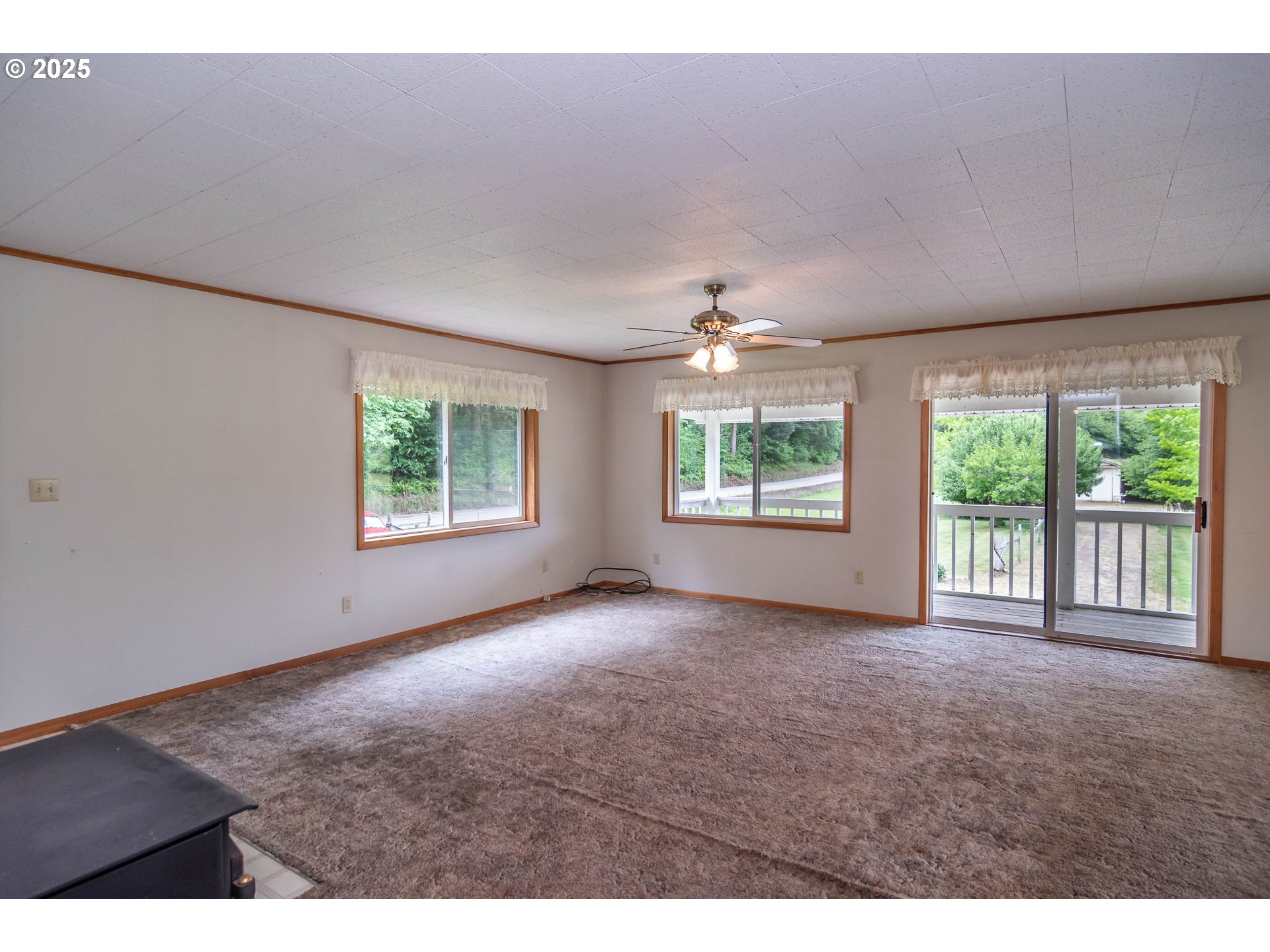 3333 Bullock Road Oakland, OR 97462 - Photo 8 of 48 an empty room with windows and an outdoor view