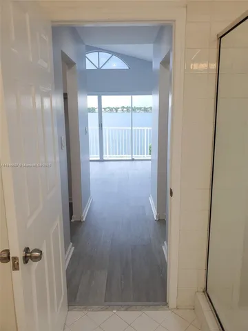 an empty room with entrance and door