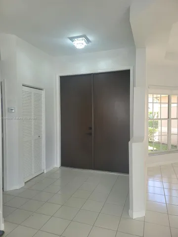 a view of empty room with floor to ceiling window