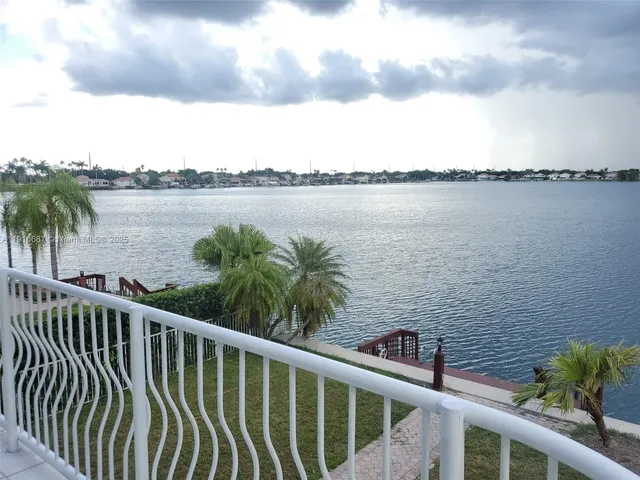 a view of a lake from a balcony