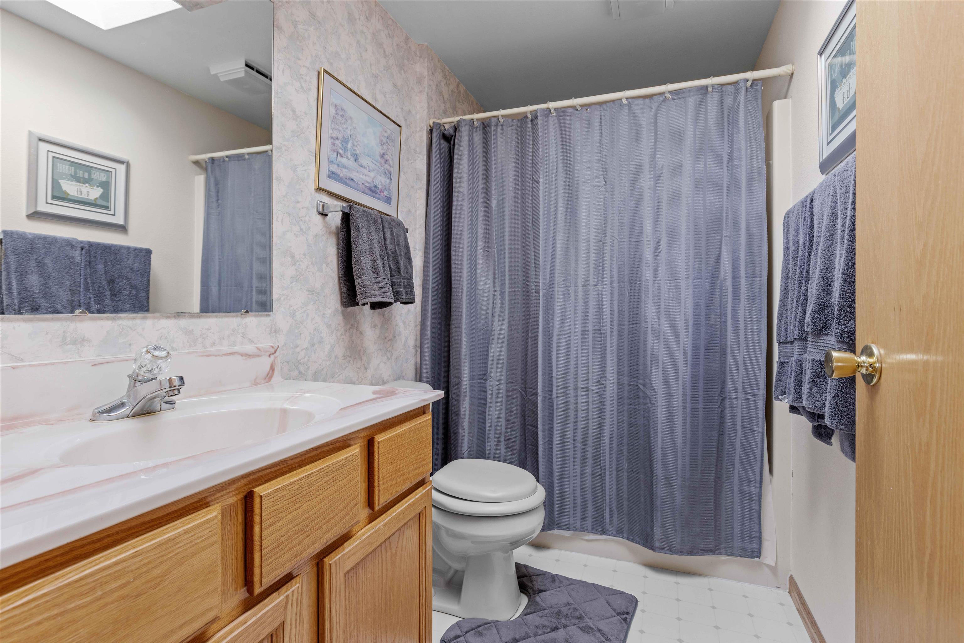 207 Redman Way Southwest Poplar Grove, IL 61065 - Photo 11 of 23 a bathroom with a sink a toilet and shower