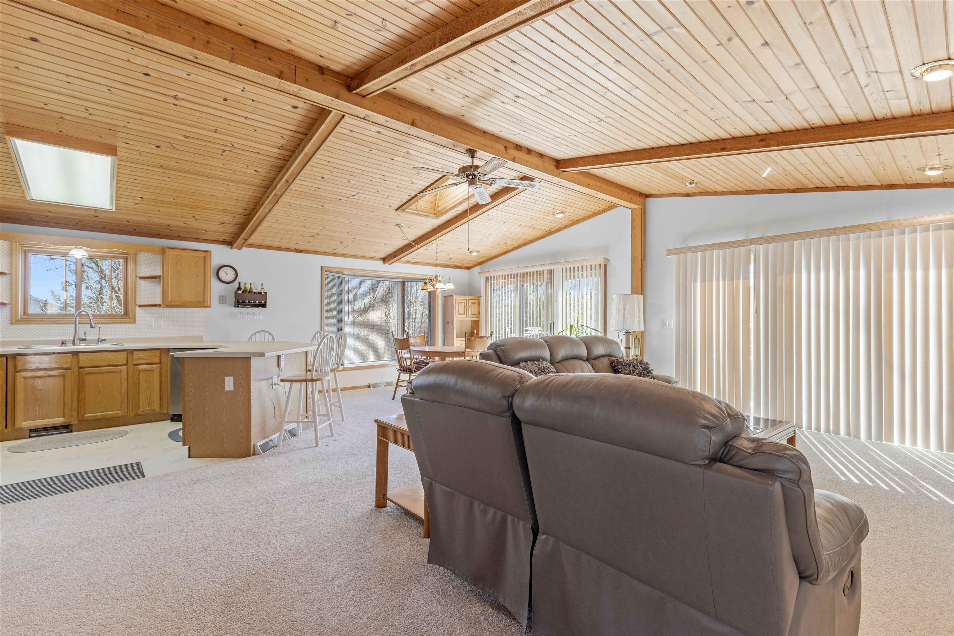 207 Redman Way Southwest Poplar Grove, IL 61065 - Photo 9 of 23 a living room with furniture and a kitchen