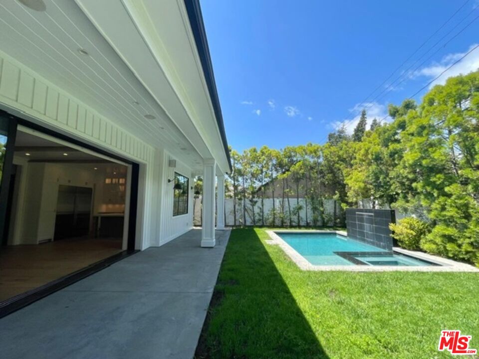 9607 Kirkside Road Los Angeles, CA 90035 - Photo 11 of 13 a view of a house with backyard and porch