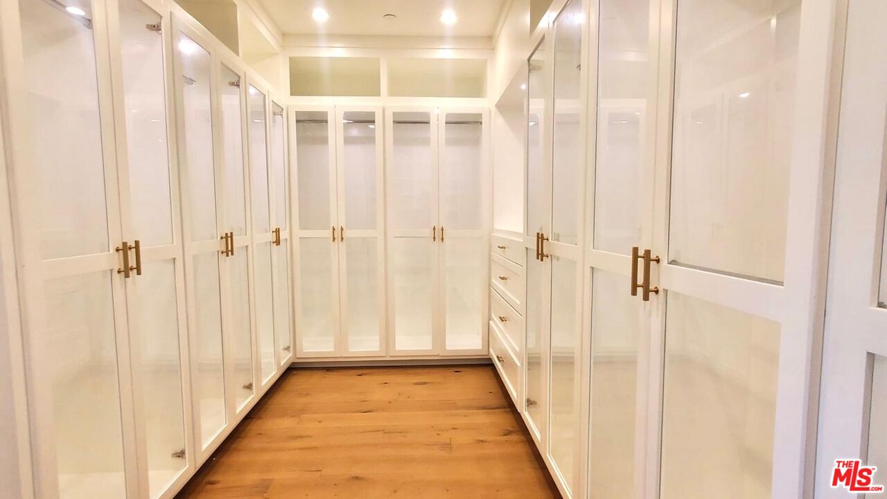 9607 Kirkside Road Los Angeles, CA 90035 - Photo 8 of 13 a view of a hallway with wooden floor and staircase