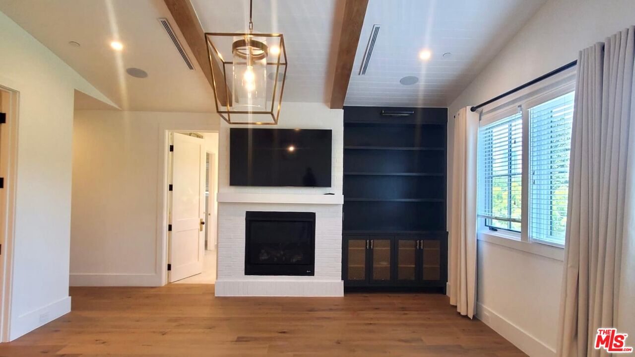 9607 Kirkside Road Los Angeles, CA 90035 - Photo 9 of 13 a view of a livingroom with a fireplace