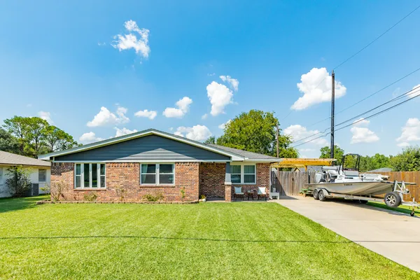 a view of a house with backyard porch and patio
