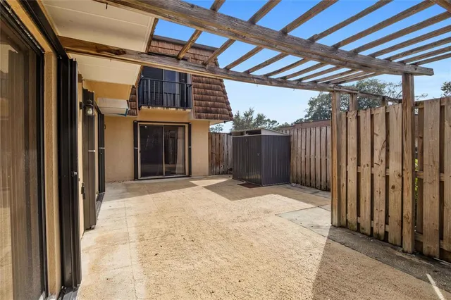 a view of a hallway with wooden walls and stairs