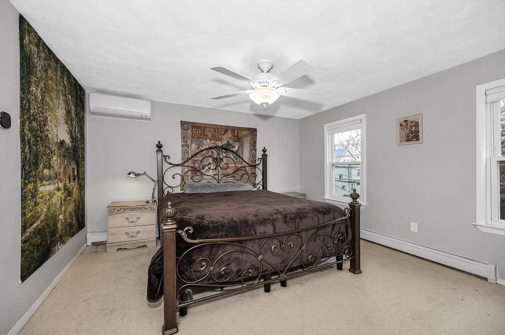 44 Mill Street Revere, MA 02151 - Photo 17 of 36 a bedroom with a bed and a window