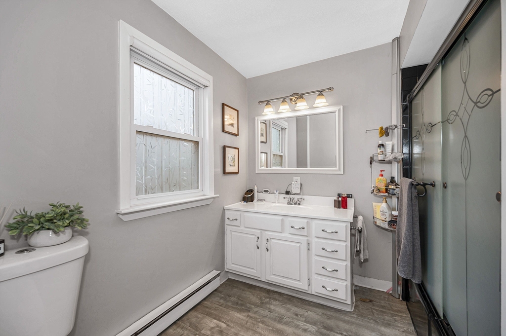 44 Mill Street Revere, MA 02151 - Photo 19 of 36 a room with a window a sink and a mirror