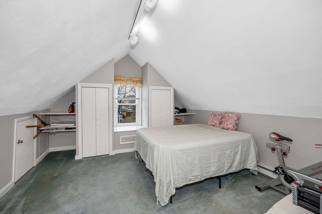 44 Mill Street Revere, MA 02151 - Photo 23 of 36 a bedroom with a bed and a large window