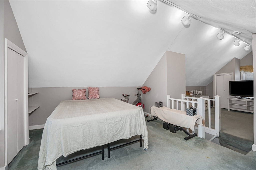 44 Mill Street Revere, MA 02151 - Photo 24 of 36 a bedroom with a bed a flat screen tv and dresser
