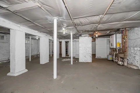 a view of empty room with air conditioner and window