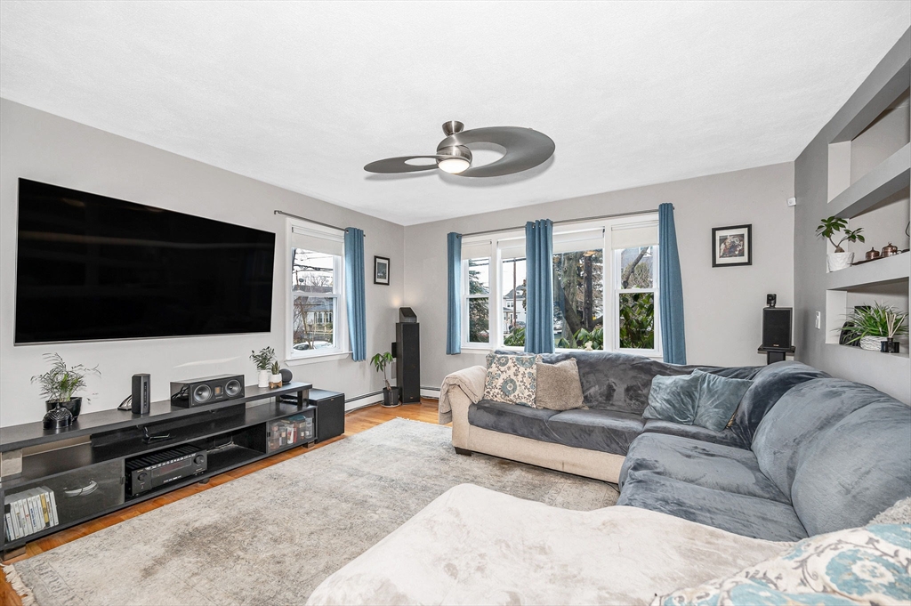 44 Mill Street Revere, MA 02151 - Photo 3 of 36 a living room with furniture and a flat screen tv