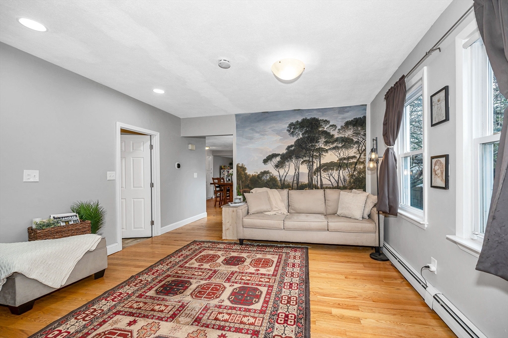 44 Mill Street Revere, MA 02151 - Photo 6 of 36 a living room with furniture and a rug