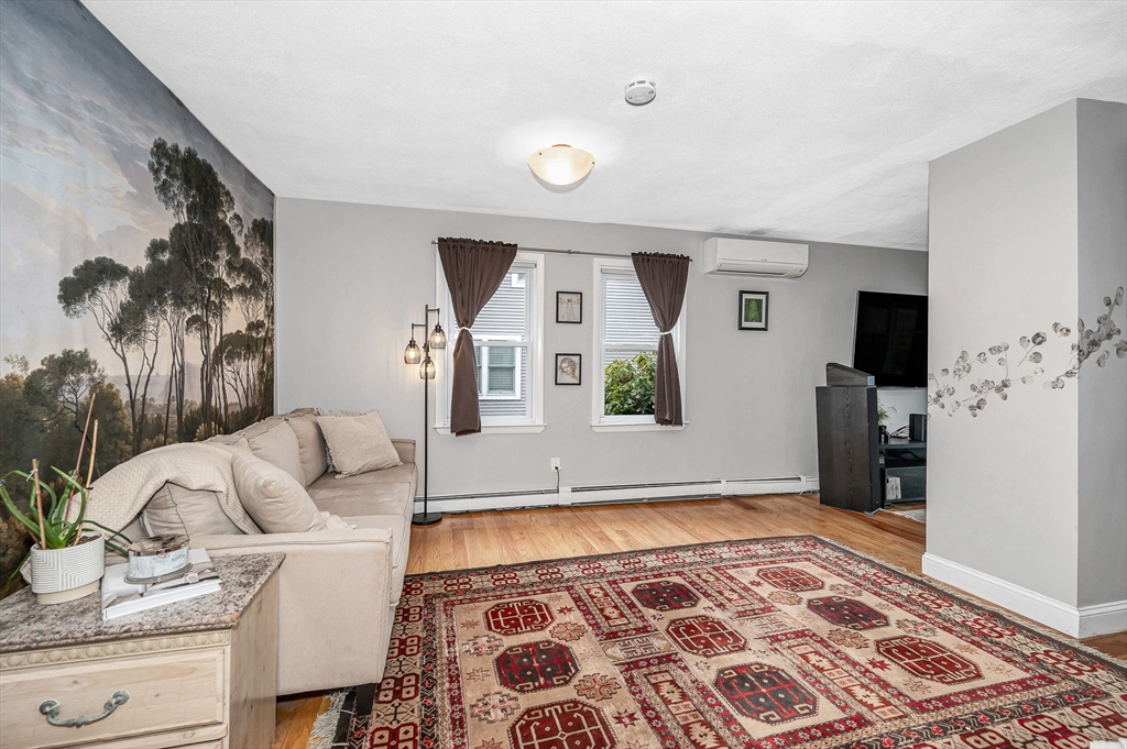 44 Mill Street Revere, MA 02151 - Photo 8 of 36 a living room with furniture and a rug