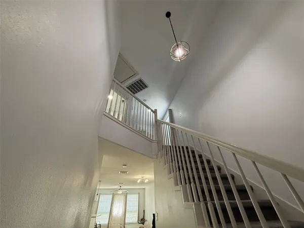 a view of gallery with wooden floor