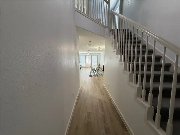 a view of a hallway view with staircase