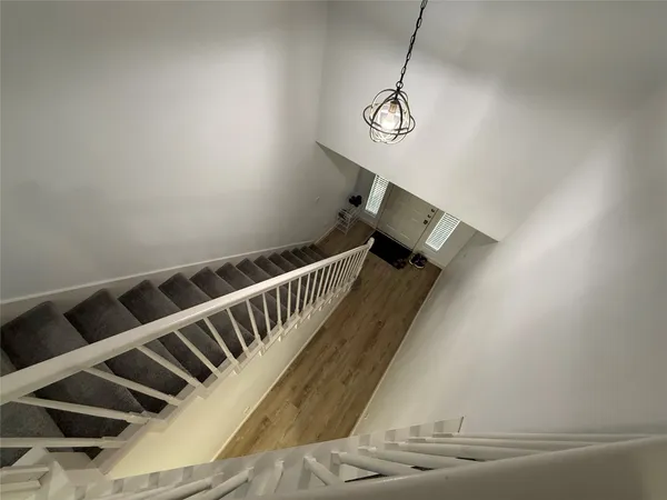 a view of a hallway with windows