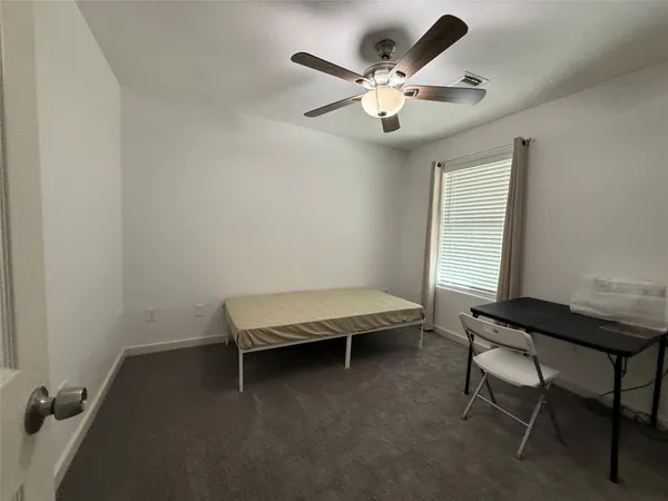 a spacious bathroom with a double vanity sink and a mirror