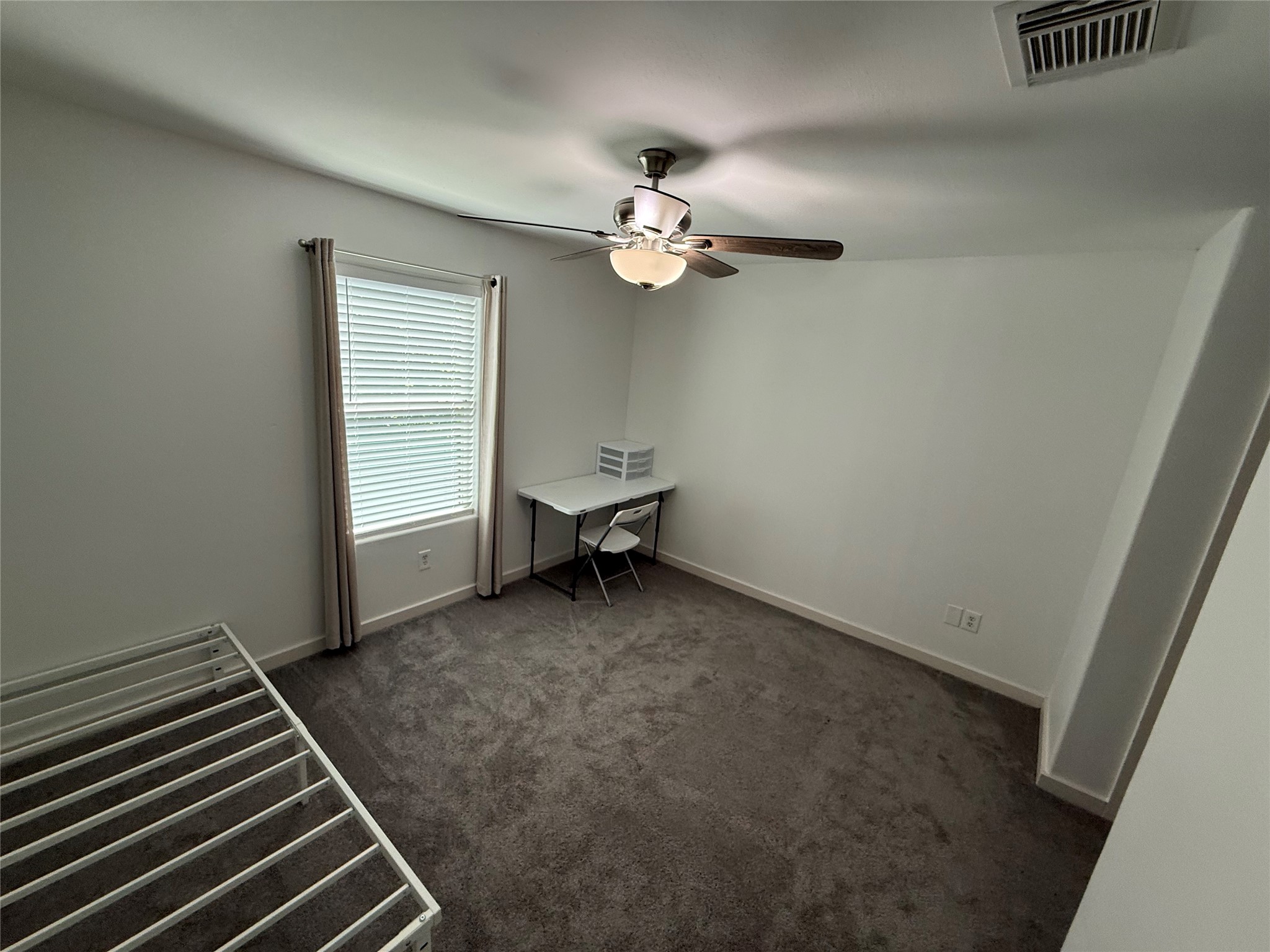 3114 Bolt Street Houston, TX 77051 - Photo 20 of 32 a view of a livingroom with a ceiling fan and a window