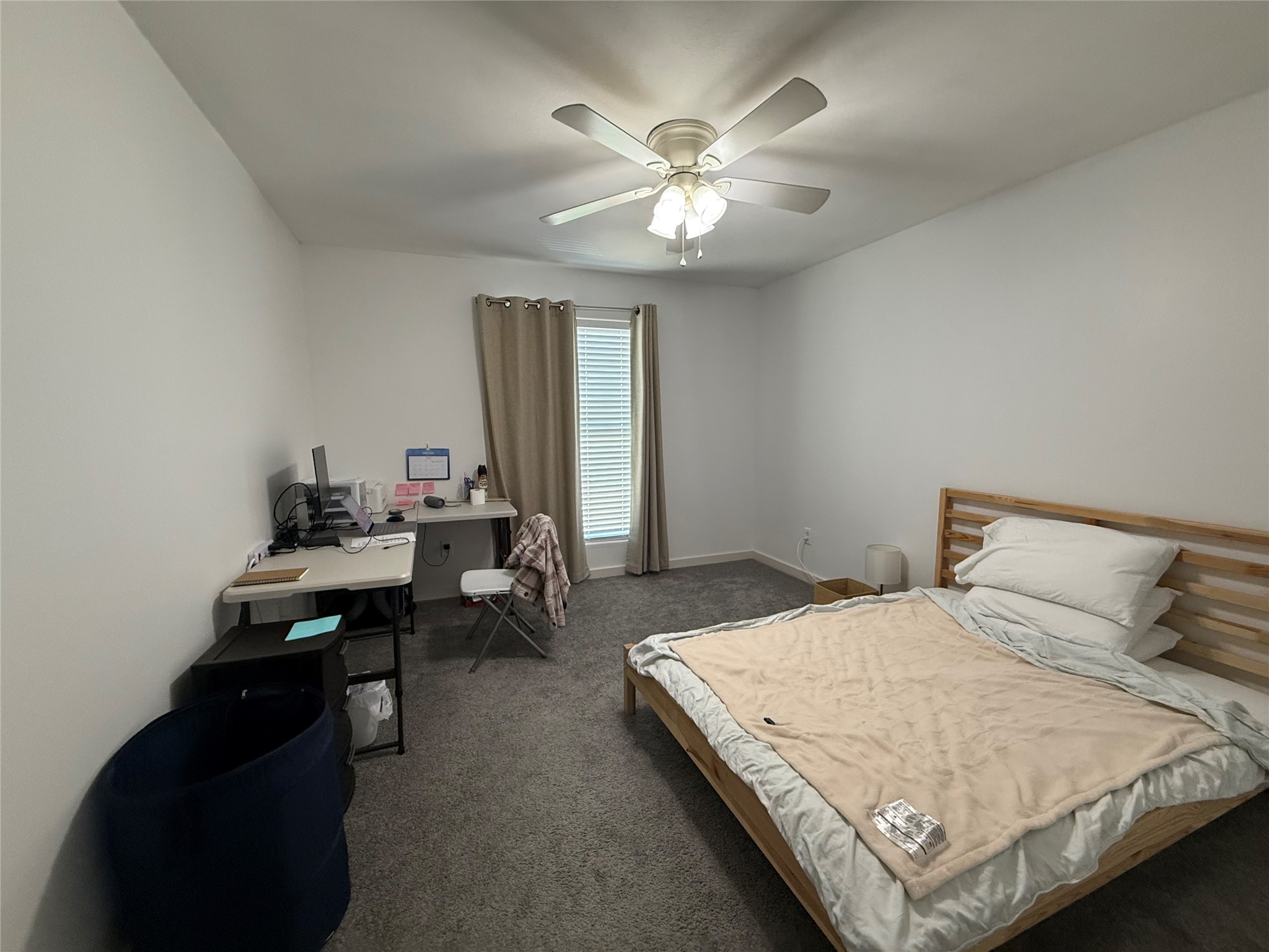 3114 Bolt Street Houston, TX 77051 - Photo 21 of 32 a bedroom with a bed and a chandelier