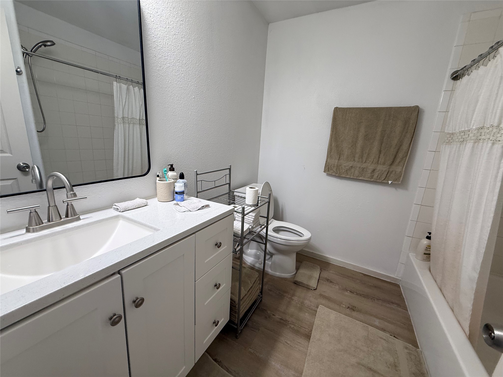 3114 Bolt Street Houston, TX 77051 - Photo 22 of 32 a spacious bathroom with a double vanity sink and a mirror