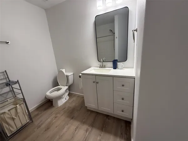 a kitchen with a sink a stove a refrigerator and cabinets