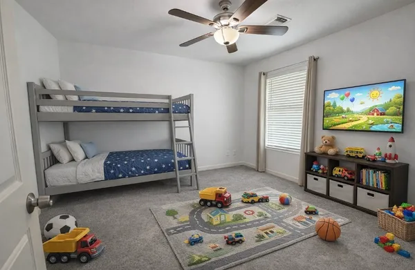 an empty room with a window and a fan