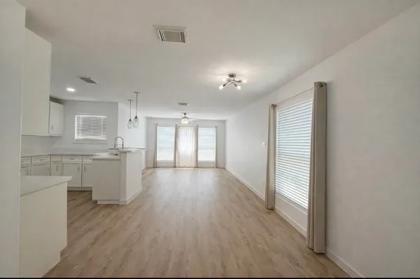 a view of an empty room and window