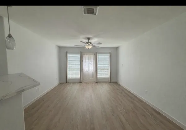 a living room with furniture and a table