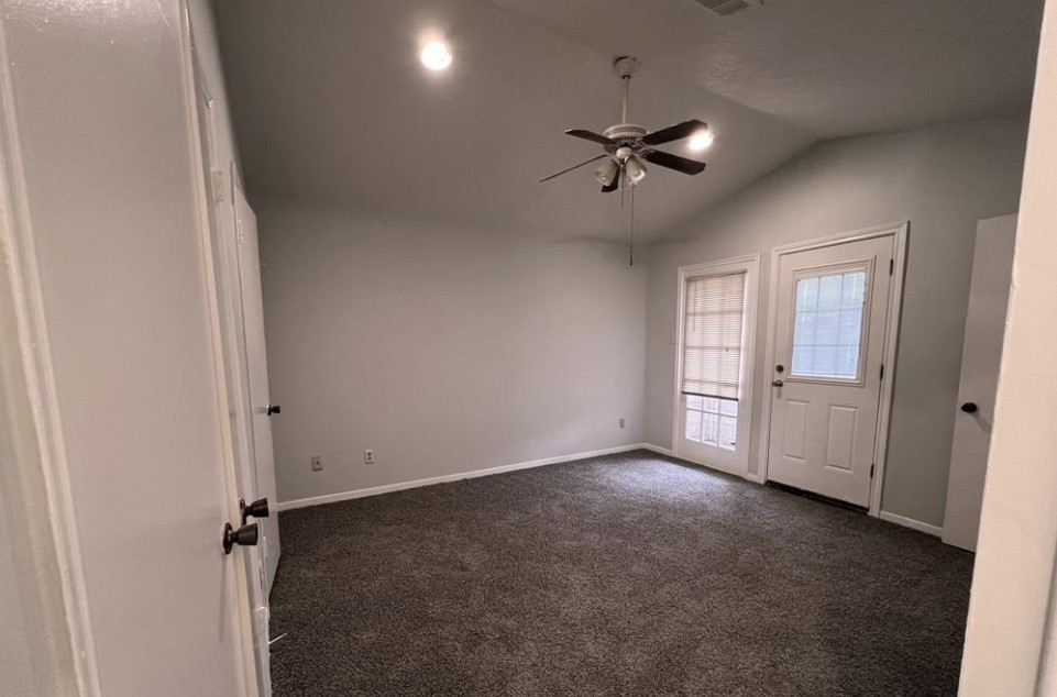11500 Meadow Lane, Unit 4 Houston, TX 77477 - Photo 23 of 32 a view of an empty room with a ceiling fan