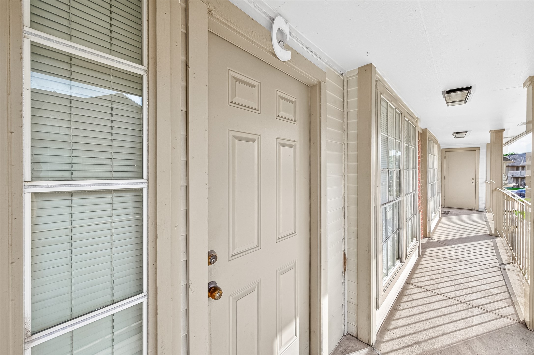 11500 Meadow Lane, Unit 4 Houston, TX 77477 - Photo 27 of 32 a view of a hallway with wooden floor and staircase