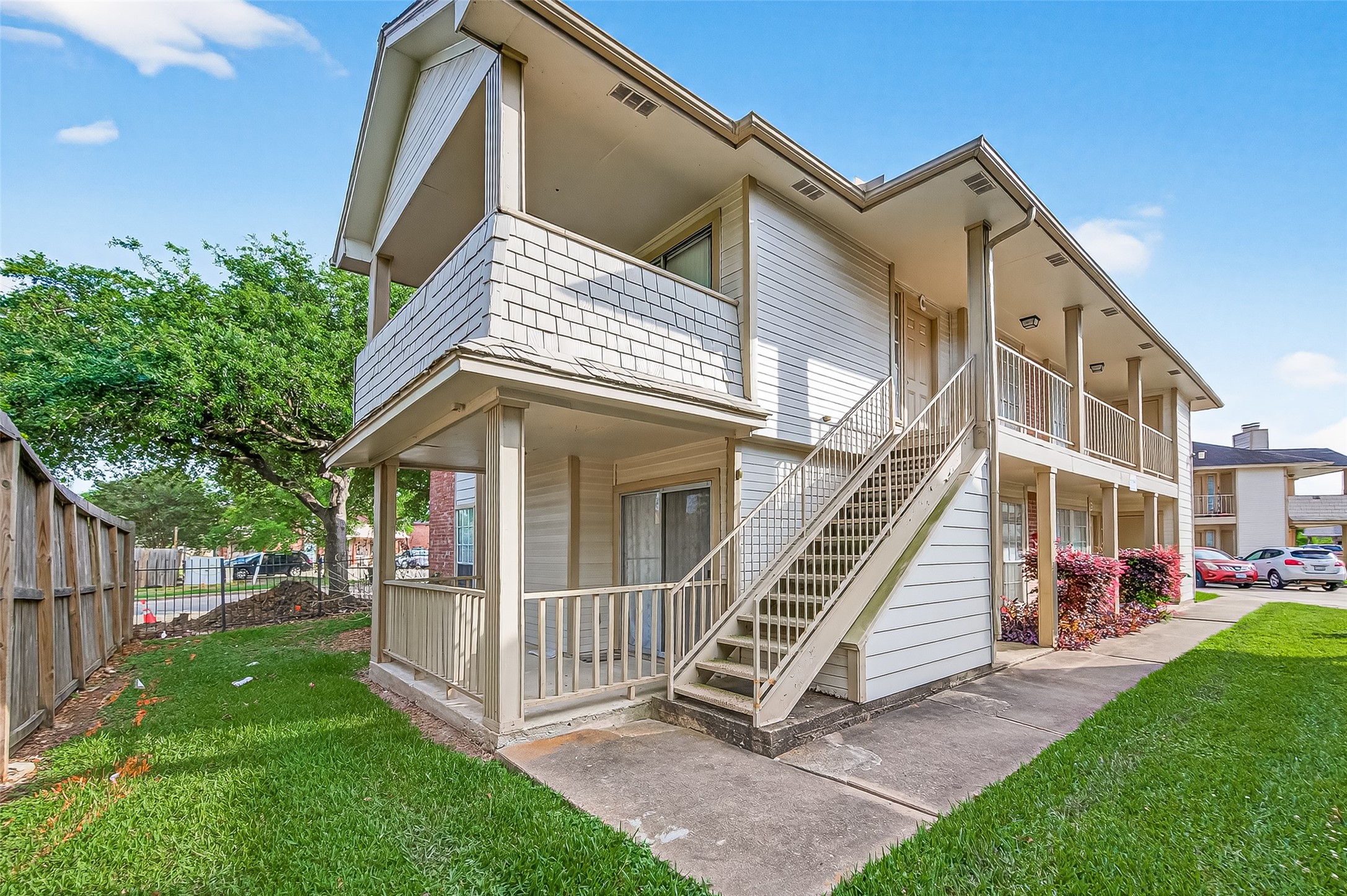 11500 Meadow Lane, Unit 4 Houston, TX 77477 - Photo 4 of 32 a view of a house with a yard and wooden fence