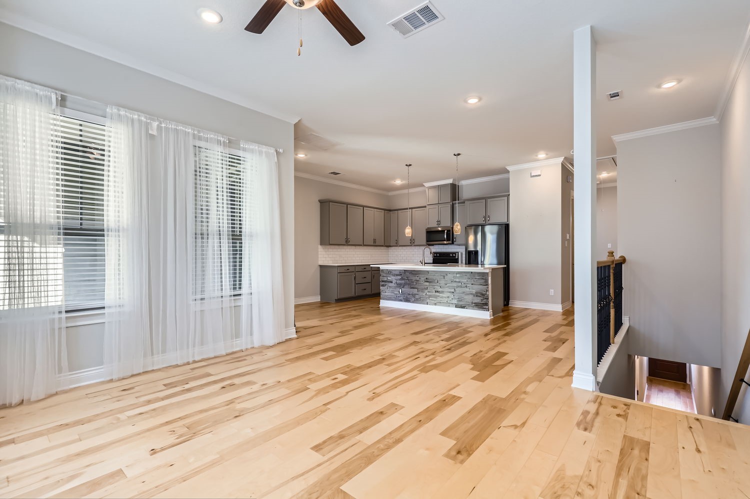 348 Adams Street Georgetown, TX 78628 - Photo 3 of 11 Spacious living room open to kitchen and dining area.