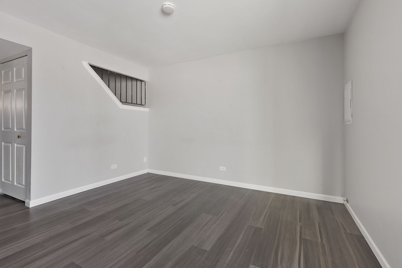 318 Rodenburg Road Roselle, IL 60172 - Photo 3 of 14 a view of an empty room with wooden floor