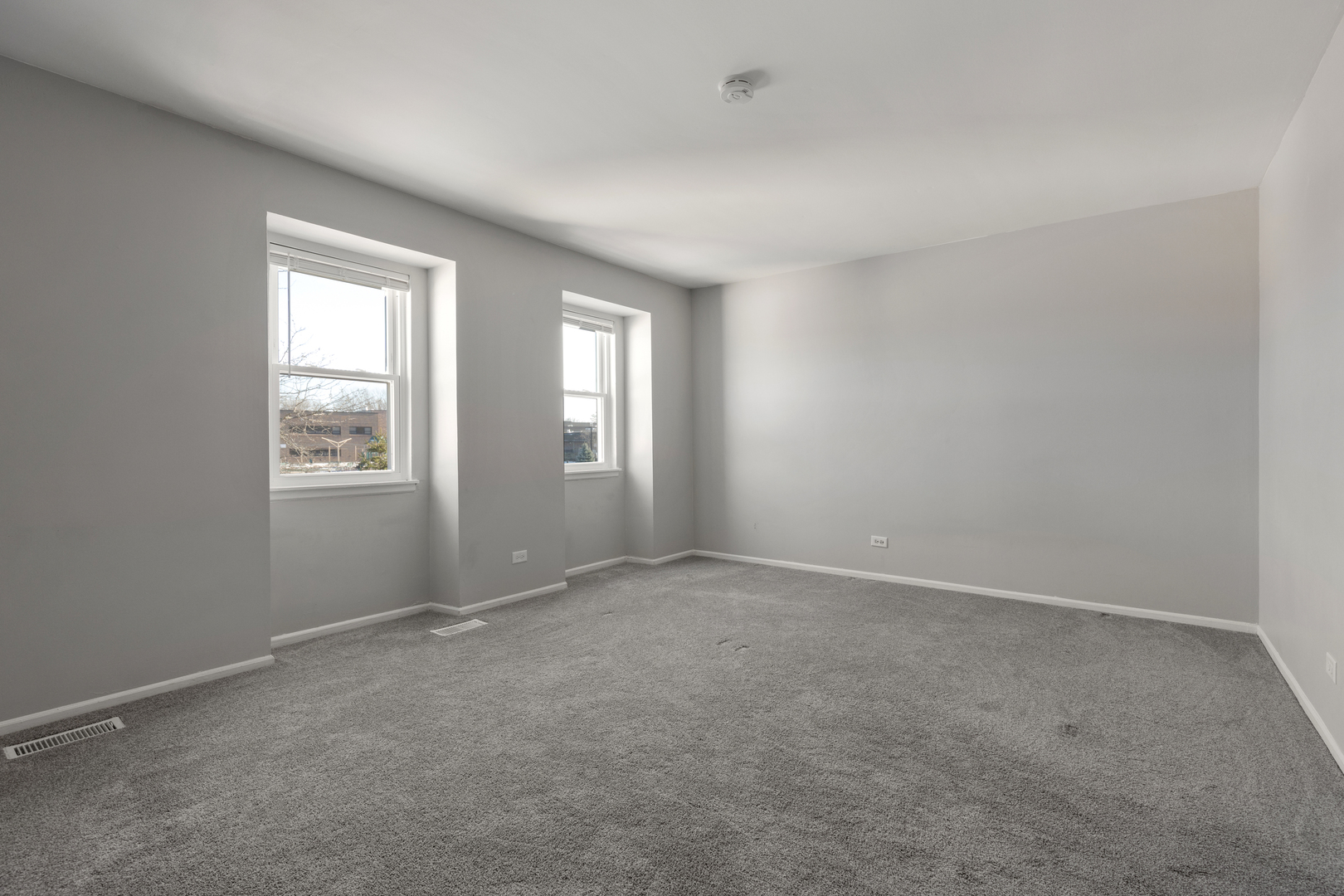 318 Rodenburg Road Roselle, IL 60172 - Photo 8 of 14 an empty room with windows
