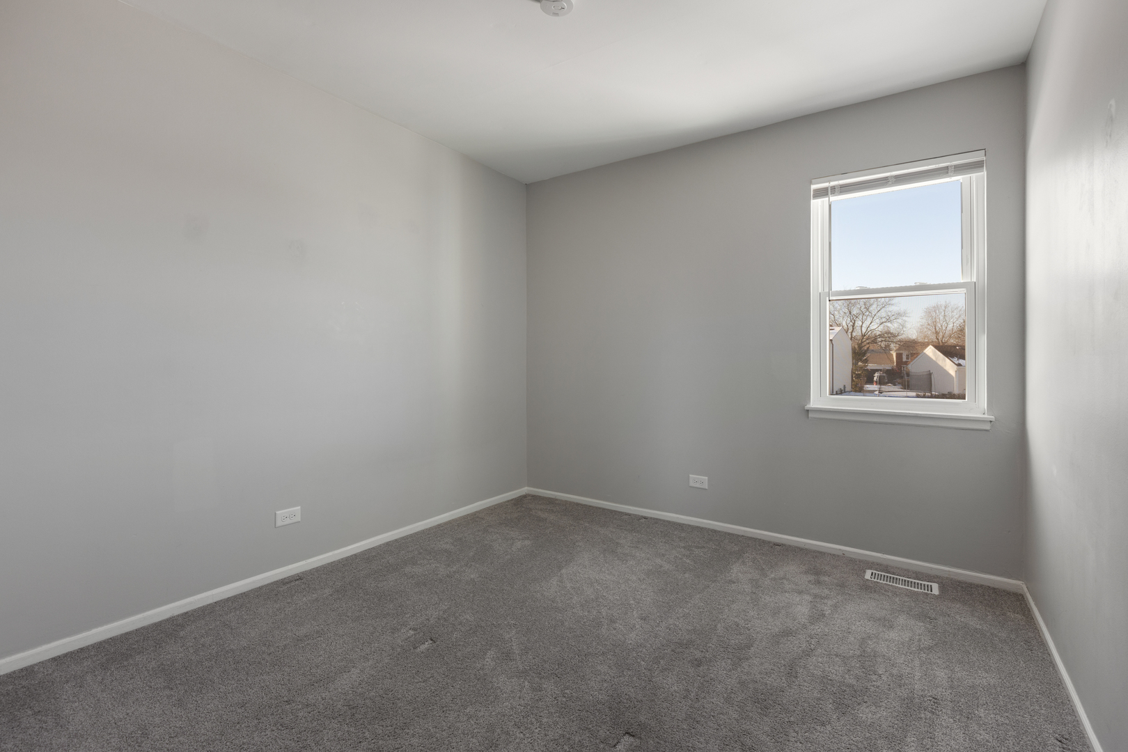 318 Rodenburg Road Roselle, IL 60172 - Photo 10 of 14 an empty room with a window