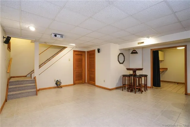a view of a livingroom with furniture and a ceiling fan