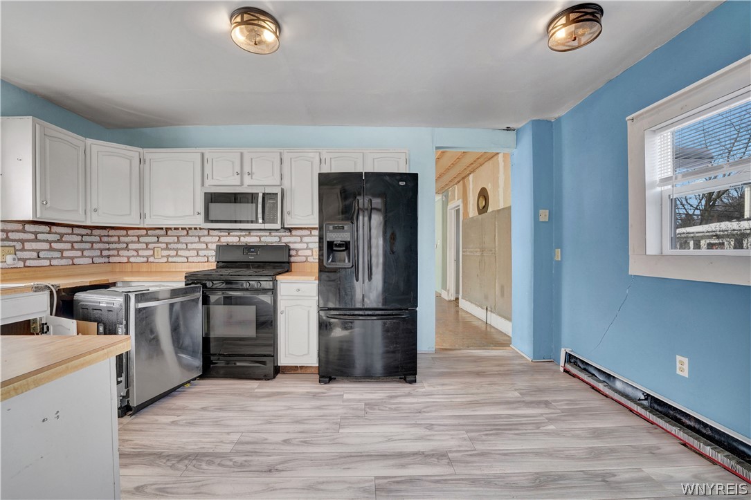 72 North Center Street Perry, NY 14530 - Photo 22 of 46 Kitchen dishwasher currently pulled out to be repa