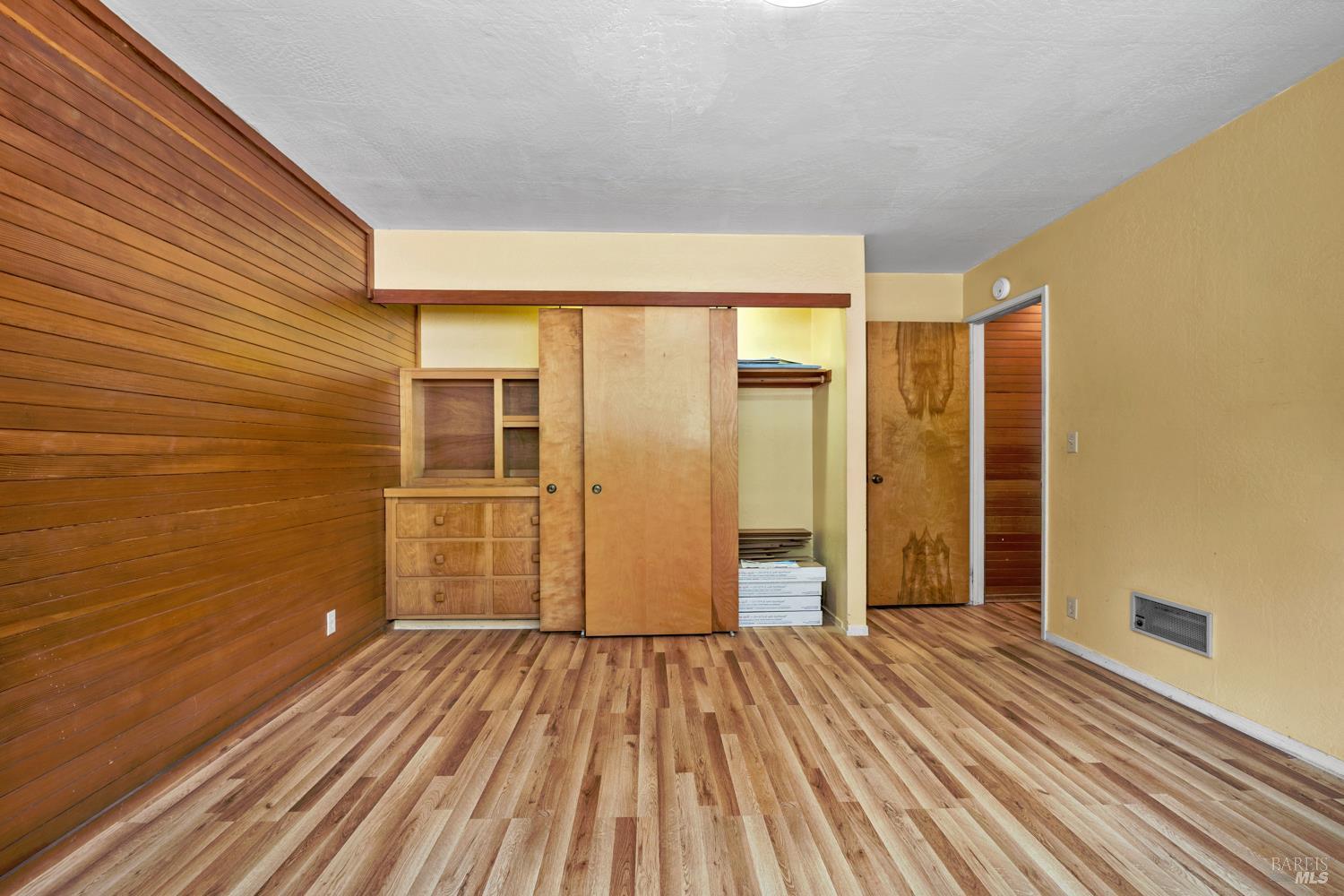 40440 Garcia River Road Point Arena, CA 95468 - Photo 14 of 49 downstairs bedroom with built in dresser (extra flooring material in the closet)