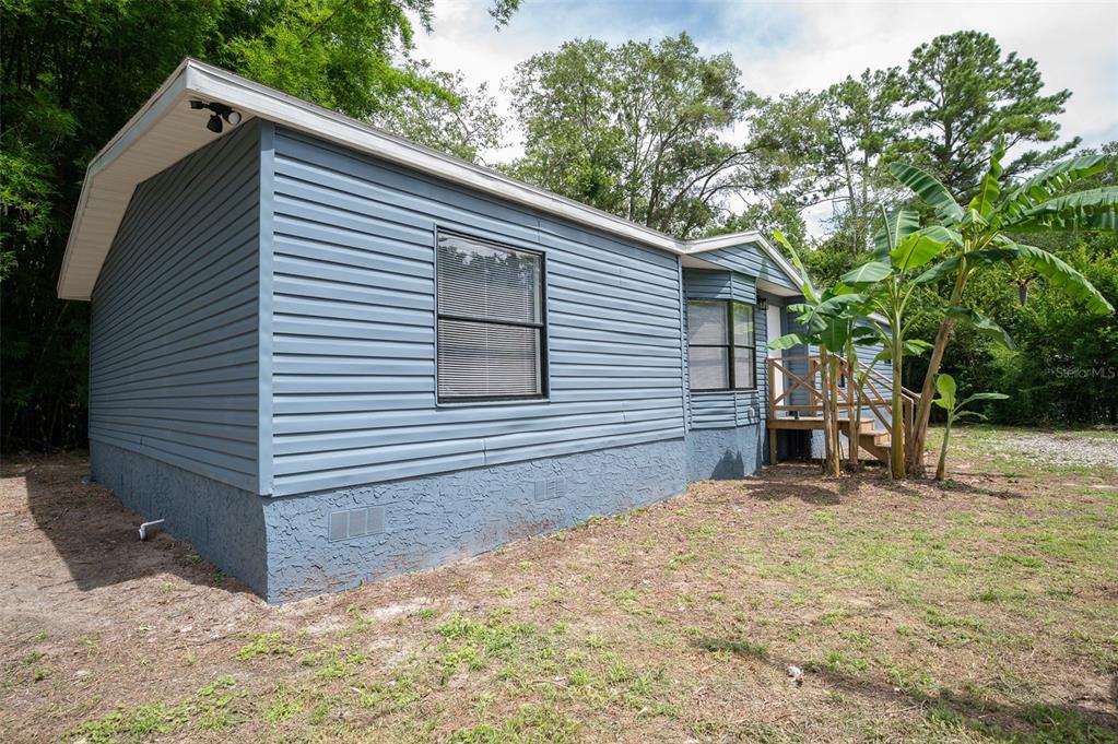 5027 Southwest 69 Street Gainesville, FL 32608 - Photo 21 of 21 a view of a house with a yard and garage