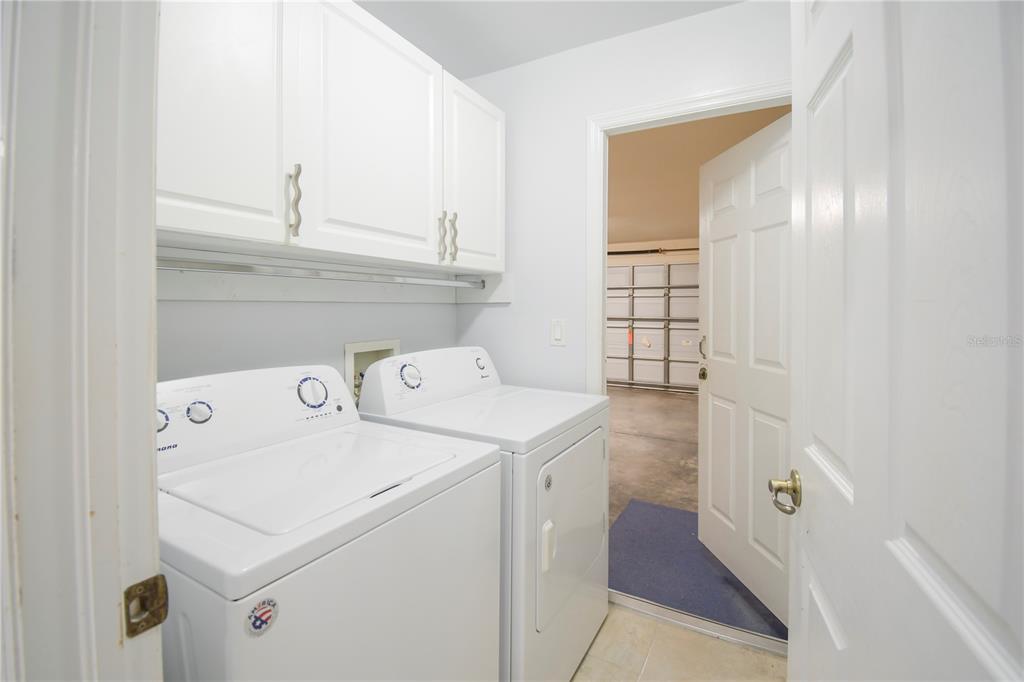 4913 Cromey Road North Port, FL 34288 - Photo 11 of 36 a utility room with dryer and washer