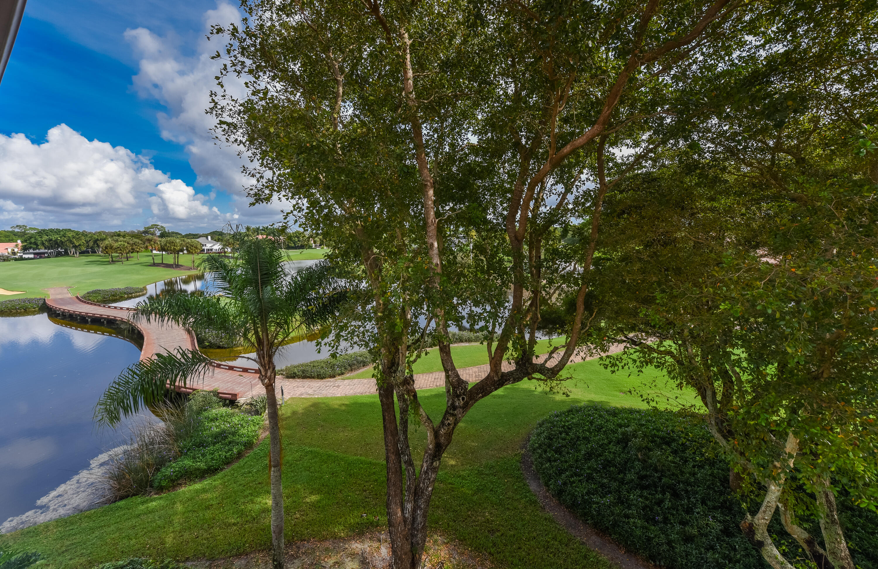7369 Orangewood Lane, Unit 303 Boca Raton, FL 33433 - Photo 13 of 56 a backyard of a house with lots of green space
