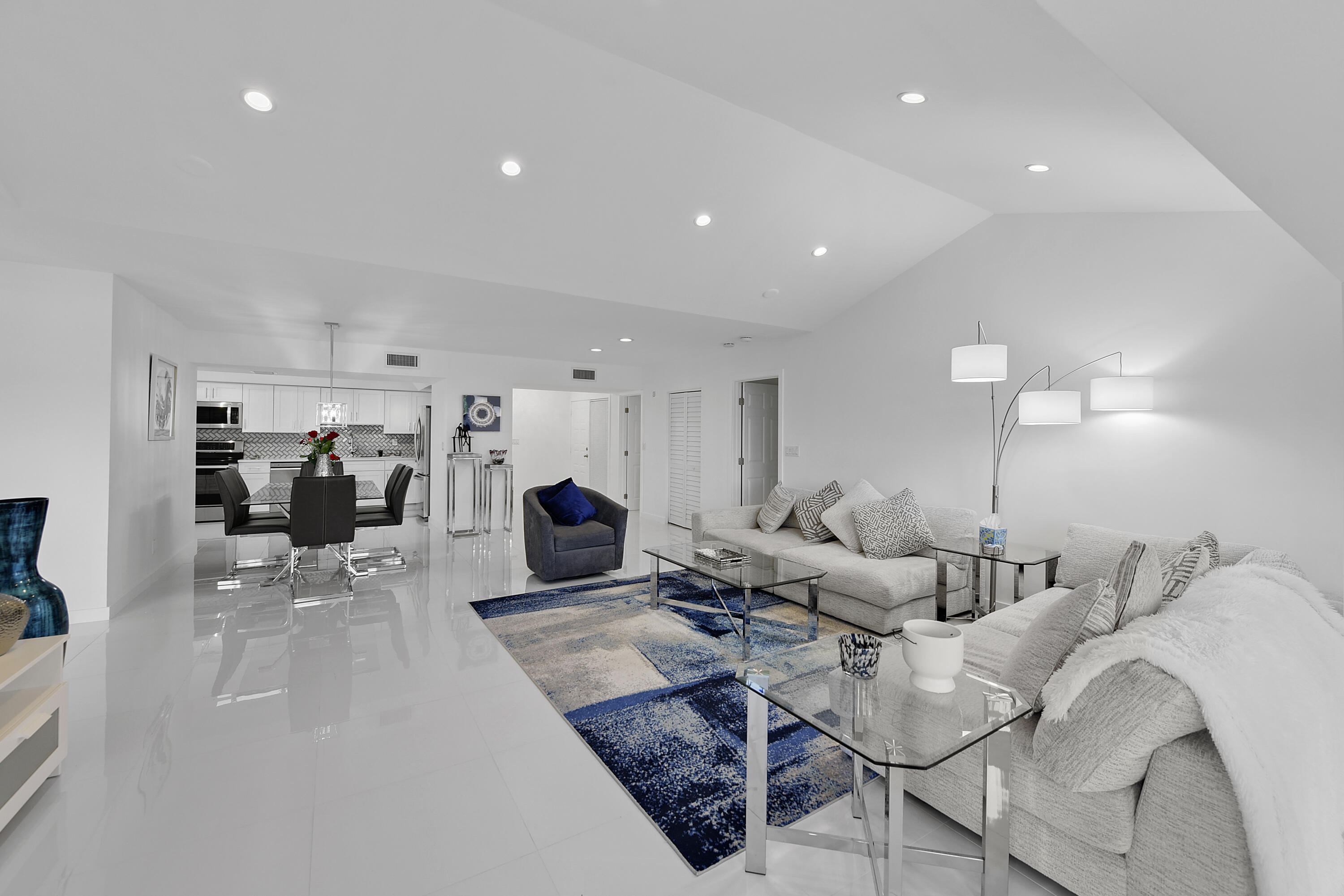 7369 Orangewood Lane, Unit 303 Boca Raton, FL 33433 - Photo 15 of 56 a living room with furniture and a table