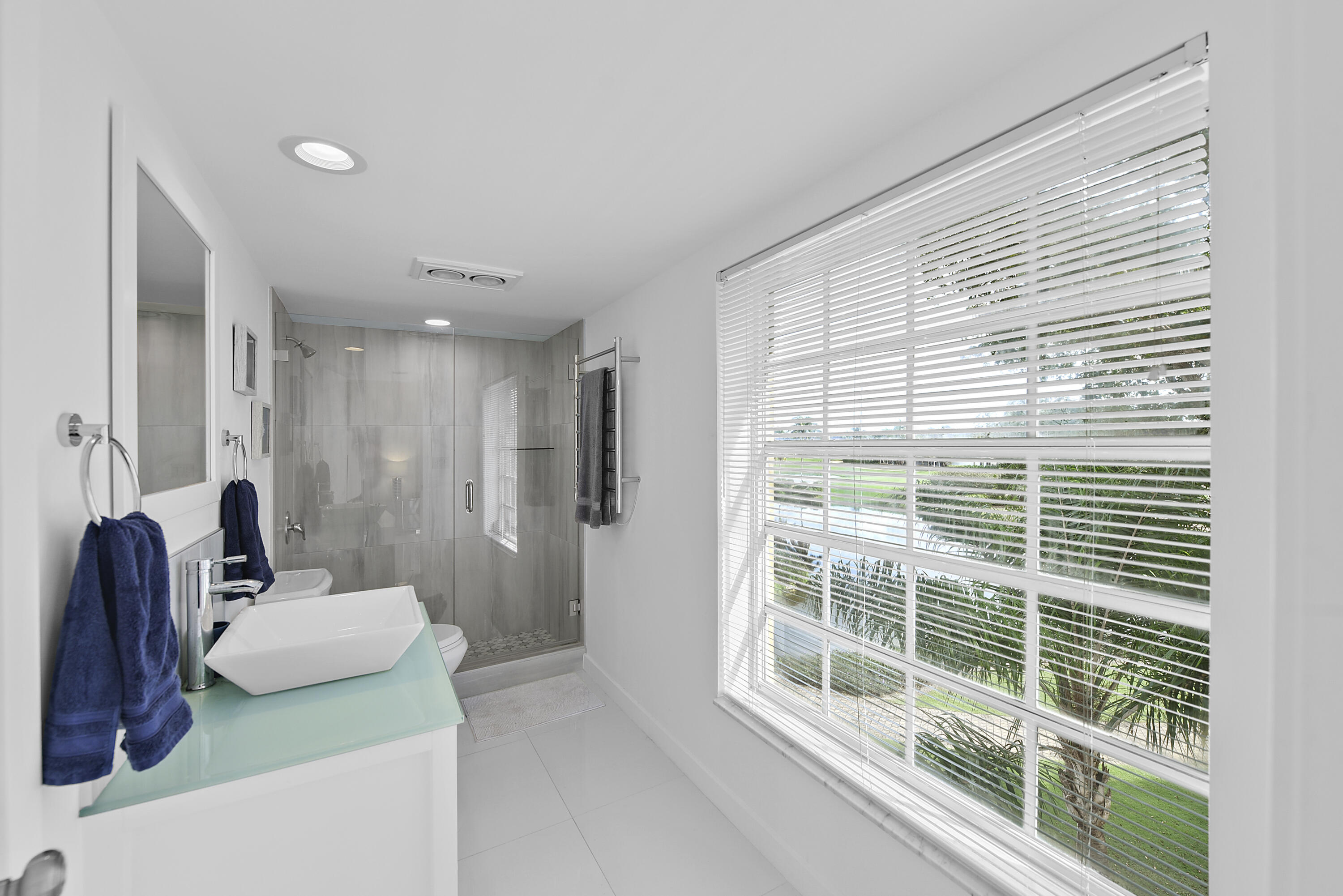 7369 Orangewood Lane, Unit 303 Boca Raton, FL 33433 - Photo 19 of 56 a bathroom with a sink and a mirror