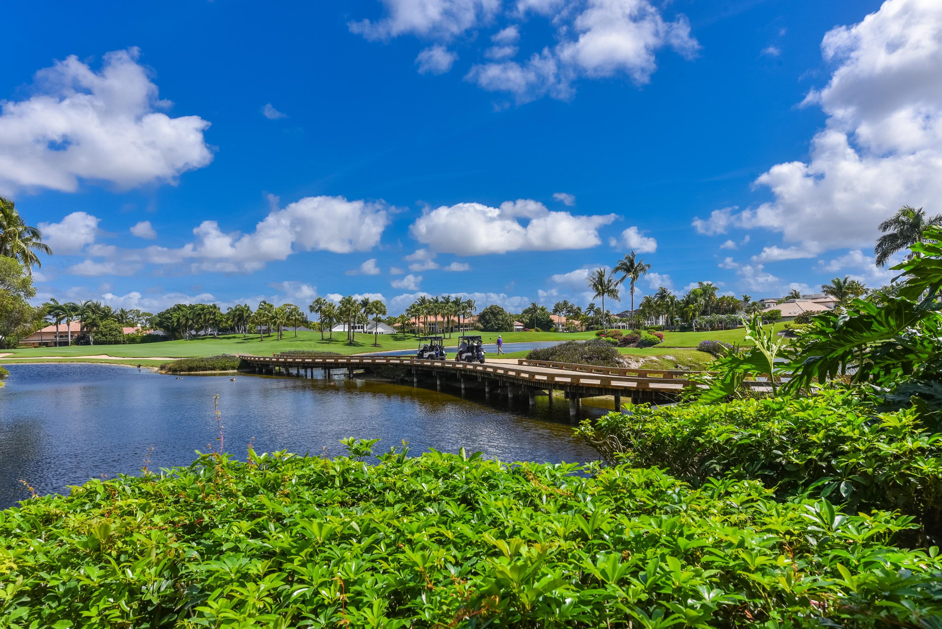 7369 Orangewood Lane, Unit 303 Boca Raton, FL 33433 - Photo 34 of 56 a view of a lake with houses in the back